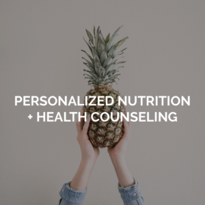 Personalized nutrition + health counseling image with person holding up a pineapple
