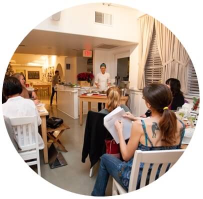 Image of clients at Real Healing Kitchen learning about cooking